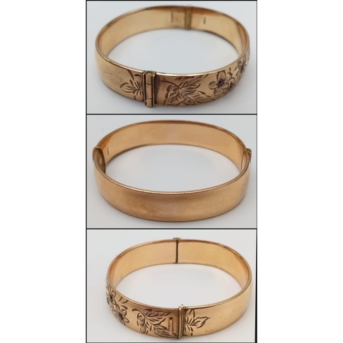 8 - A vintage 9 K yellow gold engraved bangle with round cut garnets , width: 12.8 mm, weight: 22.4 g. E... 