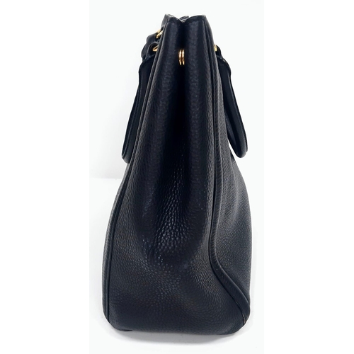 506 - Black PRADA Vitello Daino Handbag.
Luxurious leather, double handle open-top with quality gold tone ... 