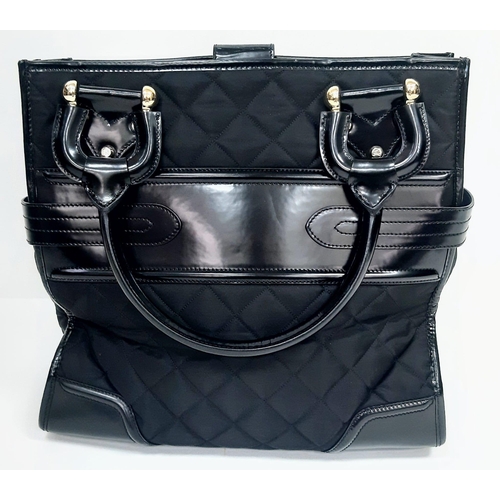 513 - Burberry Prorsum Quilted Handbag.
Features a double belt buckle design, double leather large handles... 