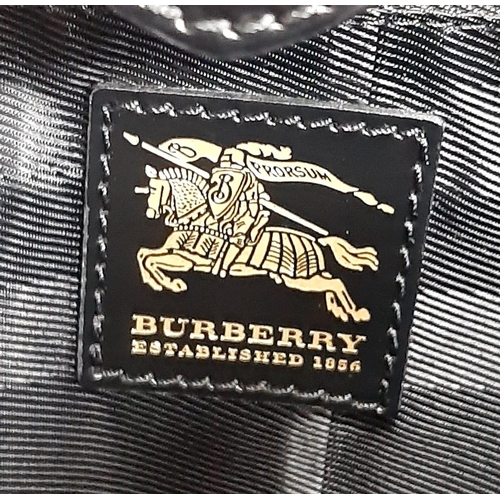 513 - Burberry Prorsum Quilted Handbag.
Features a double belt buckle design, double leather large handles... 