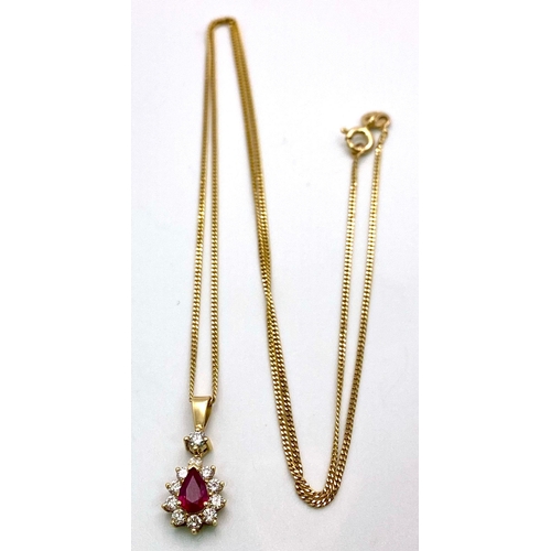 1723 - A 9K Gold, Ruby and Diamond Pendant on an 9K Gold Necklace. Teardrop ruby with a diamond halo. Penda... 