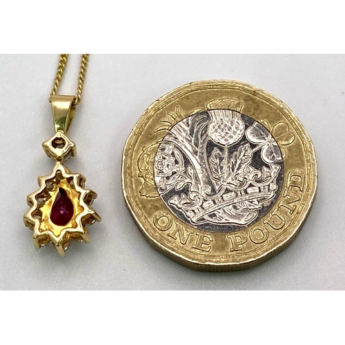 1723 - A 9K Gold, Ruby and Diamond Pendant on an 9K Gold Necklace. Teardrop ruby with a diamond halo. Penda... 