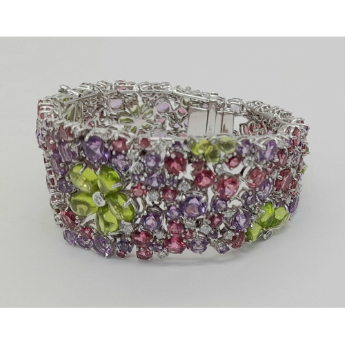 177 - A STUNNING DIAMOND AND MULTI GEMSTONE BRACELET SET IN 18K WHITE GOLD  .APPROX 17cms    52gms   01116... 