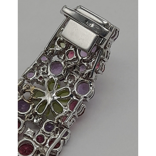 177 - A STUNNING DIAMOND AND MULTI GEMSTONE BRACELET SET IN 18K WHITE GOLD  .APPROX 17cms    52gms   01116... 