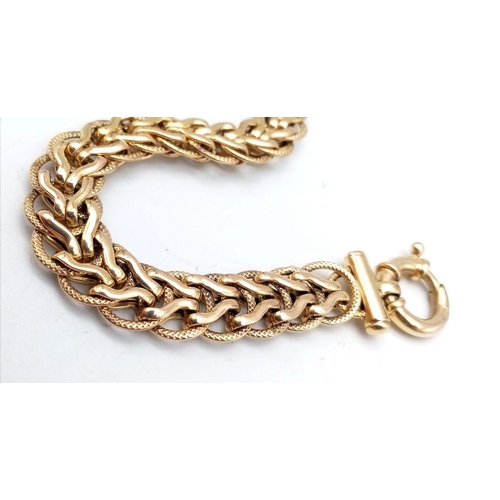 361 - A beautiful, 9 K yellow gold, Italian design, fancy link bracelet, length: 19 cm, weight: 13,2 g.