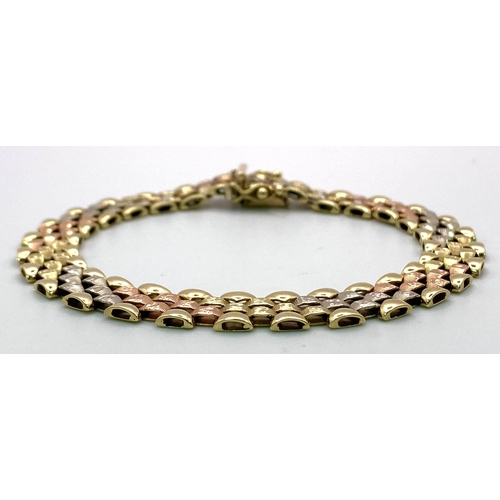 379 - A 9 K yellow, white and red gold glamorous bracelet. Clasp in excellent working order with two extra... 