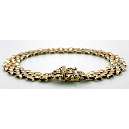 379 - A 9 K yellow, white and red gold glamorous bracelet. Clasp in excellent working order with two extra... 