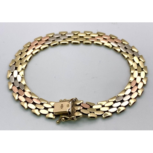 379 - A 9 K yellow, white and red gold glamorous bracelet. Clasp in excellent working order with two extra... 