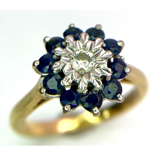 694 - A FABULOUS VINTAGE DIAMOND AND SAPPHIRE CLUSTER RING SET IN 18K GOLD .   4.6gms   size M   011147