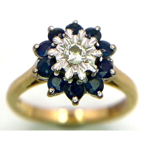 694 - A FABULOUS VINTAGE DIAMOND AND SAPPHIRE CLUSTER RING SET IN 18K GOLD .   4.6gms   size M   011147