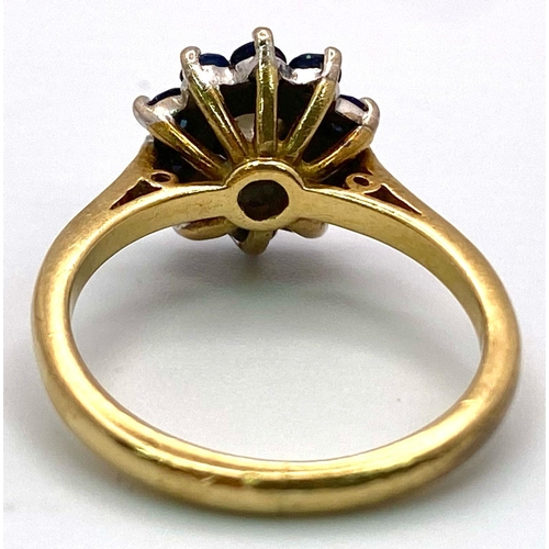 694 - A FABULOUS VINTAGE DIAMOND AND SAPPHIRE CLUSTER RING SET IN 18K GOLD .   4.6gms   size M   011147