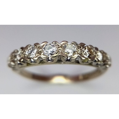 731 - AN 18K GOLD RING WITH EIGHT GRADUATED DIAMONDS TO THE TOP .  3.1gms   size O        13691