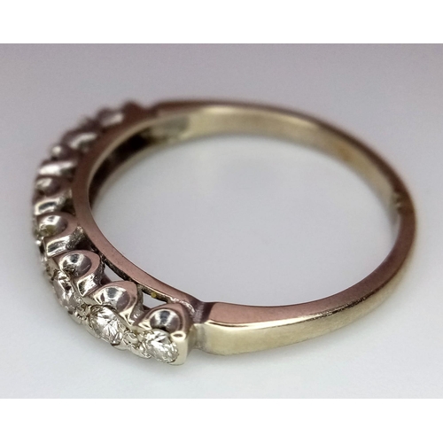 731 - AN 18K GOLD RING WITH EIGHT GRADUATED DIAMONDS TO THE TOP .  3.1gms   size O        13691