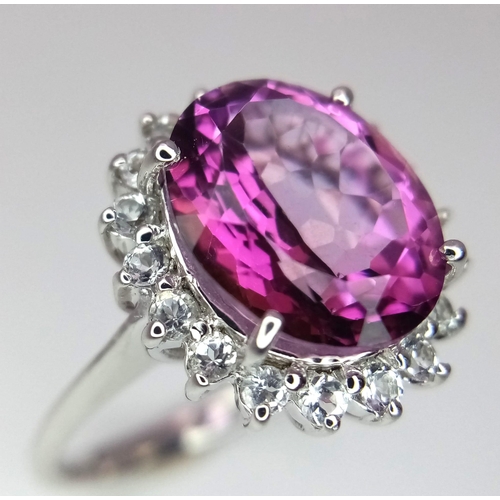 1720 - A 9K White Gold, Pink Stone (Possibly Tourmaline) and Diamond Halo. Size O. 5.16g total weight. Ref:... 