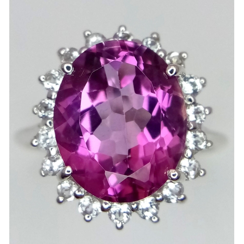 1720 - A 9K White Gold, Pink Stone (Possibly Tourmaline) and Diamond Halo. Size O. 5.16g total weight. Ref:... 