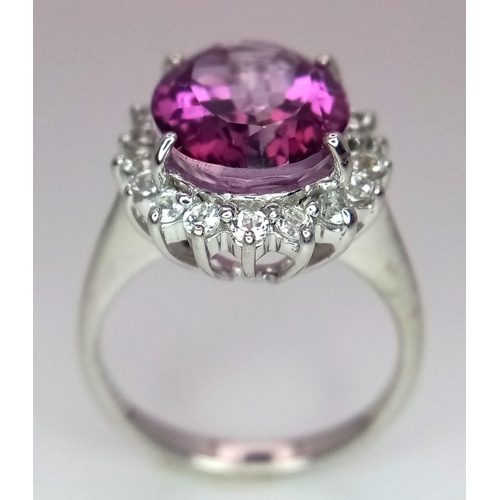 1720 - A 9K White Gold, Pink Stone (Possibly Tourmaline) and Diamond Halo. Size O. 5.16g total weight. Ref:... 