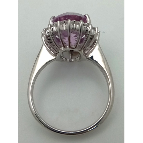 1720 - A 9K White Gold, Pink Stone (Possibly Tourmaline) and Diamond Halo. Size O. 5.16g total weight. Ref:... 