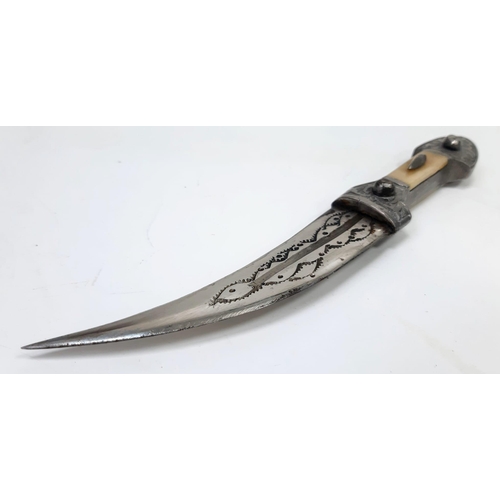 457 - A Vintage or Antique Silver or White Metal Arabic Dagger with Bone Inlay Handle. 21.5cm Length.
209 ... 