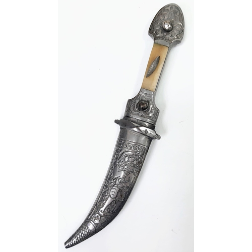 457 - A Vintage or Antique Silver or White Metal Arabic Dagger with Bone Inlay Handle. 21.5cm Length.
209 ... 