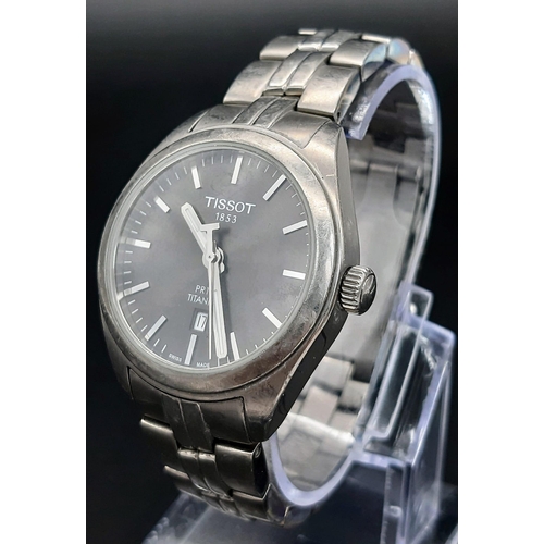 918 - A Tissot PR100 Titanium Unisex Watch. Titanium bracelet and case - 33mm. Silver tone dial with date ... 