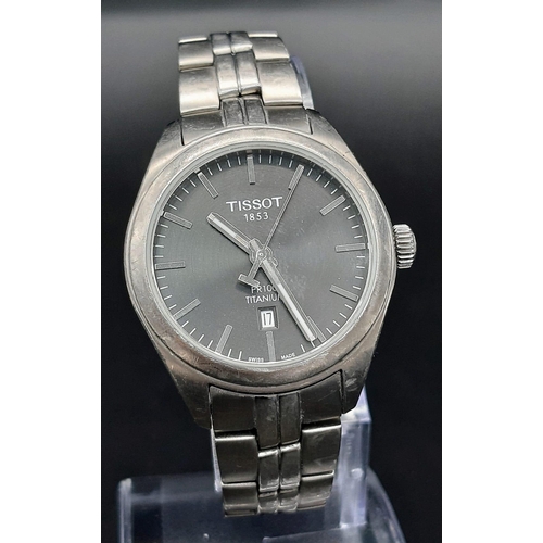 918 - A Tissot PR100 Titanium Unisex Watch. Titanium bracelet and case - 33mm. Silver tone dial with date ... 