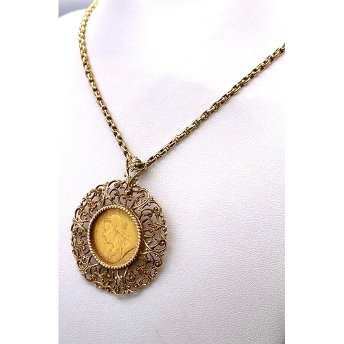 120 - A 9 K yellow gold very artistic pendant with a full gold sovereign of Queen Victoria 1895, on a subs... 