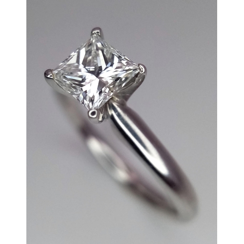 163 - A DIAMOND SOLITAIRE RING WITH CENTRAL PRINCESS CUT .66CT DIAMOND AND SET IN 14K WHITE GOLD . COMES W... 