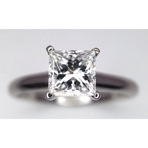 163 - A DIAMOND SOLITAIRE RING WITH CENTRAL PRINCESS CUT .66CT DIAMOND AND SET IN 14K WHITE GOLD . COMES W... 