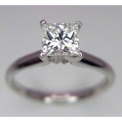 163 - A DIAMOND SOLITAIRE RING WITH CENTRAL PRINCESS CUT .66CT DIAMOND AND SET IN 14K WHITE GOLD . COMES W... 