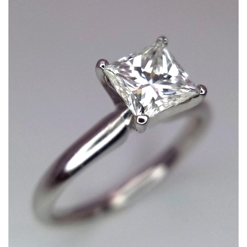 163 - A DIAMOND SOLITAIRE RING WITH CENTRAL PRINCESS CUT .66CT DIAMOND AND SET IN 14K WHITE GOLD . COMES W... 