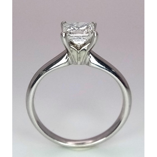 163 - A DIAMOND SOLITAIRE RING WITH CENTRAL PRINCESS CUT .66CT DIAMOND AND SET IN 14K WHITE GOLD . COMES W... 