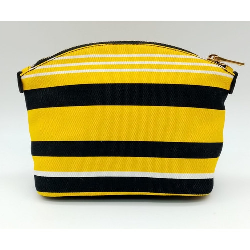 339 - A Prada Yellow, Black and White Pouch. Textile exterior, with gold tone hardware and top zip, and th... 