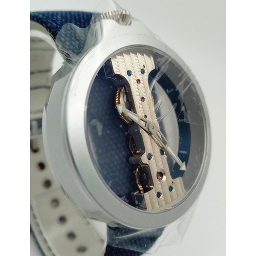 588 - Atto Verticale Masera Mechanical Skeleton Watch.
Denim feel Leather strap with a pale blue underside... 