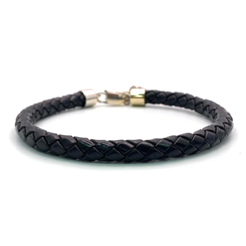 284 - A BLACK TWISTED LEATHER BRACELET WITH 18K WHITE GOLD ENDS AND CLASP PLUS AN 18K GOLD AND DIAMOND CHA... 