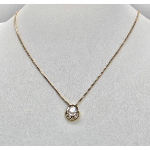 184 - A DESIGNER WHITE AND YELLOW GOLD DIAMOND PENDANT ON A 40cme 14K GOLD CHAIN .4.25gms  009048