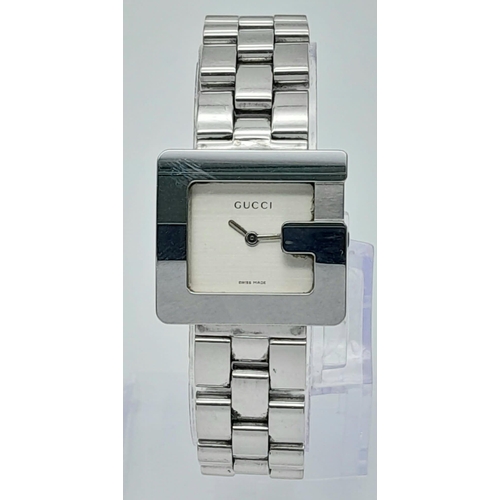 897 - A Stylish Gucci Designer Ladies Watch. Stainless steel bracelet and 'G' shape case - 23mm. Silver to... 