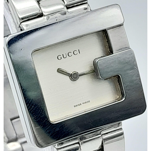 897 - A Stylish Gucci Designer Ladies Watch. Stainless steel bracelet and 'G' shape case - 23mm. Silver to... 