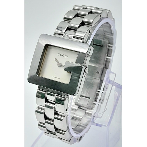 897 - A Stylish Gucci Designer Ladies Watch. Stainless steel bracelet and 'G' shape case - 23mm. Silver to... 