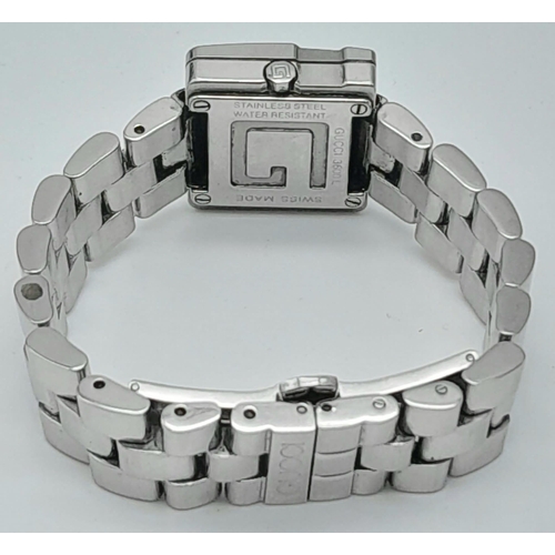 897 - A Stylish Gucci Designer Ladies Watch. Stainless steel bracelet and 'G' shape case - 23mm. Silver to... 