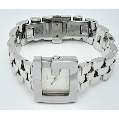 897 - A Stylish Gucci Designer Ladies Watch. Stainless steel bracelet and 'G' shape case - 23mm. Silver to... 