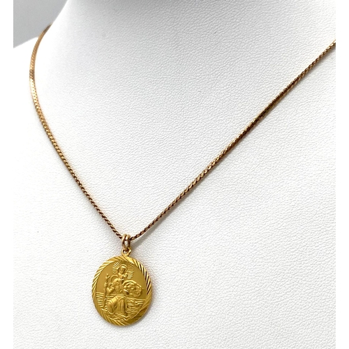 32 - A 9K Yellow Gold St. Christopher Pendant on a 9K Yellow Gold Necklace. Pendant - 17mm diameter. Neck... 