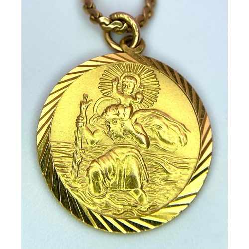 32 - A 9K Yellow Gold St. Christopher Pendant on a 9K Yellow Gold Necklace. Pendant - 17mm diameter. Neck... 