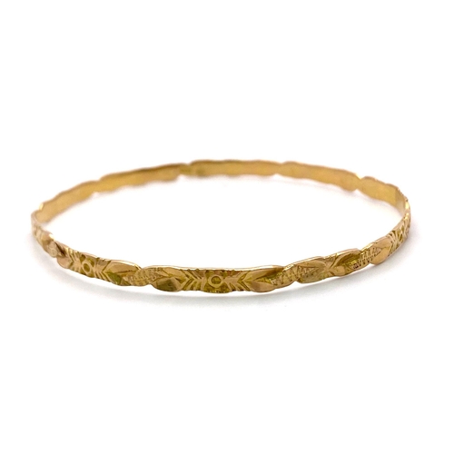 4 - A Vintage 18K Gold Bangle with Decorative Twist Design. 
7.67g weight.