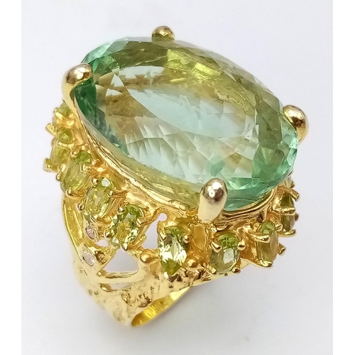 118 - A statement sterling silver and richly gilded ring with a massive (65 carats app.) fluorite surround... 