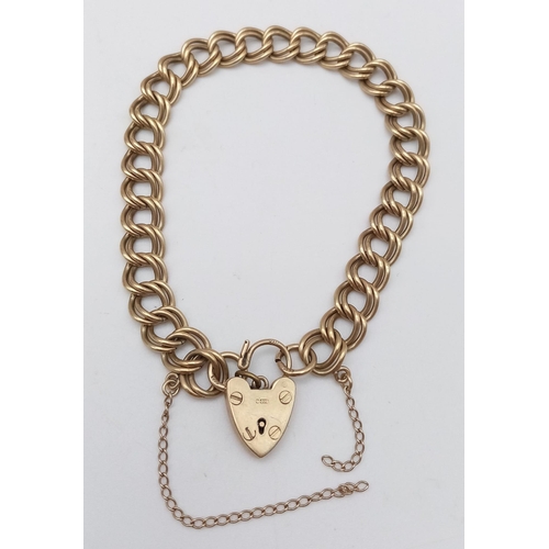 8 - A Vintage 9K Yellow Gold Double Curb Link Bracelet with Heart Clasp. 17cm. 13.54g weight.