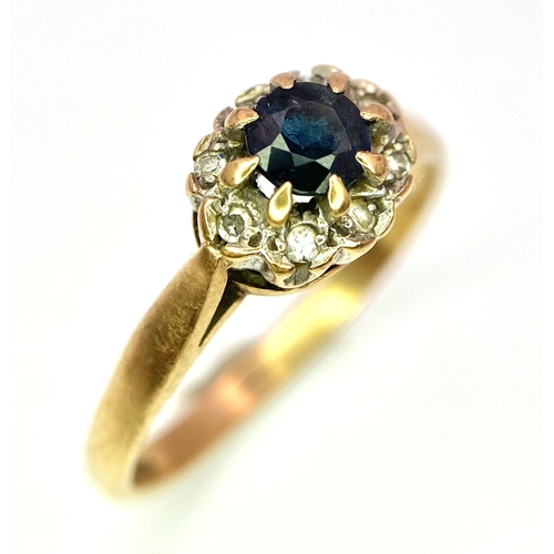 34 - A 9K Yellow Gold Sapphire and Diamond Ring. Central sapphire with diamond halo. Size O. 2.28g total ... 