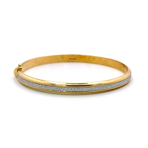 349 - A 9K Yellow Gold Clip Bangle with Encrusted White Stone Decoration. 6cm inner diameter. 5.25g weight... 