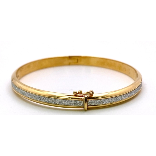 349 - A 9K Yellow Gold Clip Bangle with Encrusted White Stone Decoration. 6cm inner diameter. 5.25g weight... 