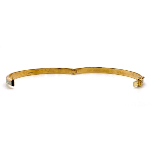 349 - A 9K Yellow Gold Clip Bangle with Encrusted White Stone Decoration. 6cm inner diameter. 5.25g weight... 