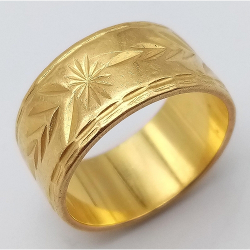 44 - A Rich 22k Yellow Gold Band Ring with Arrowhead and Star Decoration. Size N. 10.7g weight.